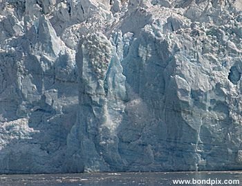 Calving ice falls from the Hubbard Glacier in Yakutat bay, Alaska