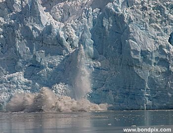 Calving ice falls from the Hubbard Glacier in Yakutat bay, Alaska