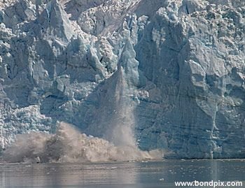 Calving ice falls from the Hubbard Glacier in Yakutat bay, Alaska
