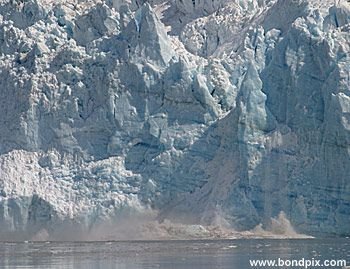 Calving ice falls from the Hubbard Glacier in Yakutat bay, Alaska