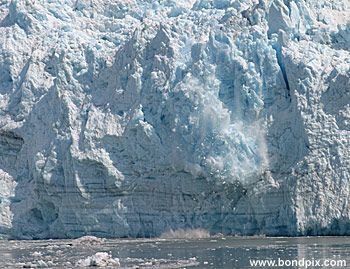 Calving ice falls from the Hubbard Glacier in Yakutat bay, Alaska