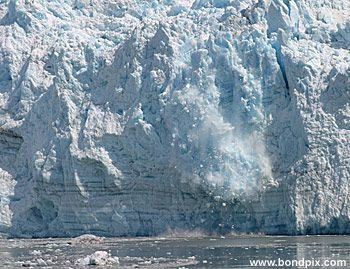 Calving ice falls from the Hubbard Glacier in Yakutat bay, Alaska