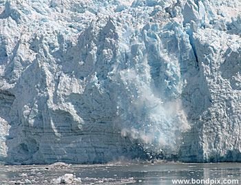 Calving ice falls from the Hubbard Glacier in Yakutat bay, Alaska
