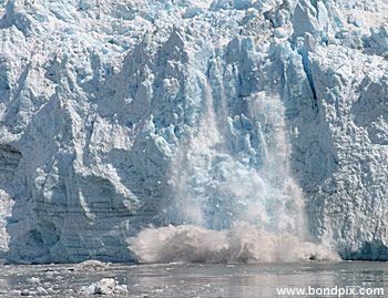 Calving ice falls from the Hubbard Glacier in Yakutat bay, Alaska