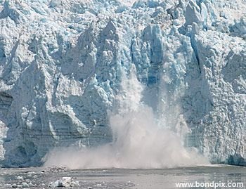 Calving ice falls from the Hubbard Glacier in Yakutat bay, Alaska