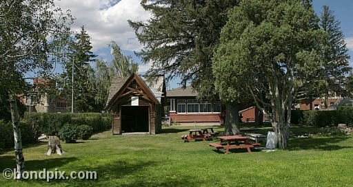 Deer Lodge Museums, Montana, Picnic gardens and old Carriage House wood cabin